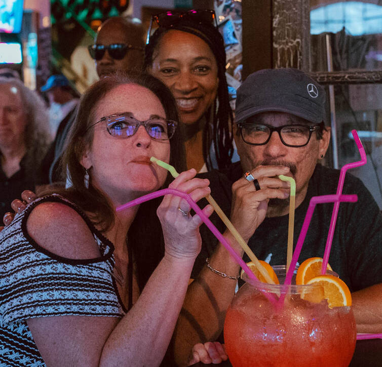 group enjoying a fishbowl